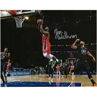 ZION WILLIAMSON NEW ORLEANS PELICANS AUTOGRAPHED 8" X 10" GOING UP VS. NEW YORK KNICKS PHOTOGRAPH