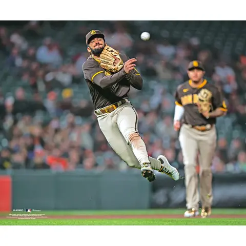 FERNANDO TATIS JR. SAN DIEGO PADRES UNSIGNED FIELDING AND THROWING BALL PHOTOGRAPH